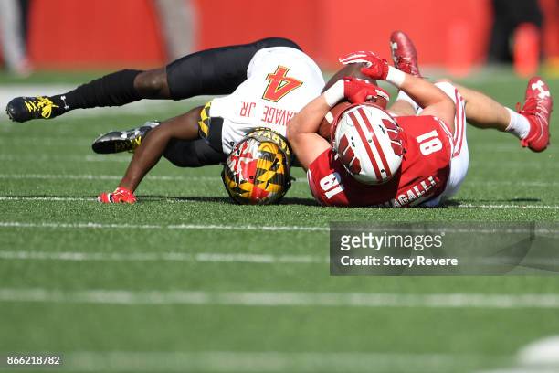 Troy Fumagalli of the Wisconsin Badgers is brought down by Darnell Savage Jr. #4 of the Maryland Terrapins during a game at Camp Randall Stadium on...