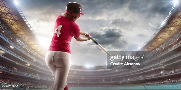 softball female player on a professional arena - softball glove stock pictures, royalty-free photos & images