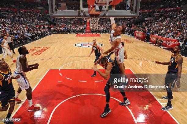 Blake Griffin of the LA Clippers dunks the ball while guarded by Rudy Gobert of the Utah Jazz on October 24, 2017 at STAPLES Center in Los Angeles,...