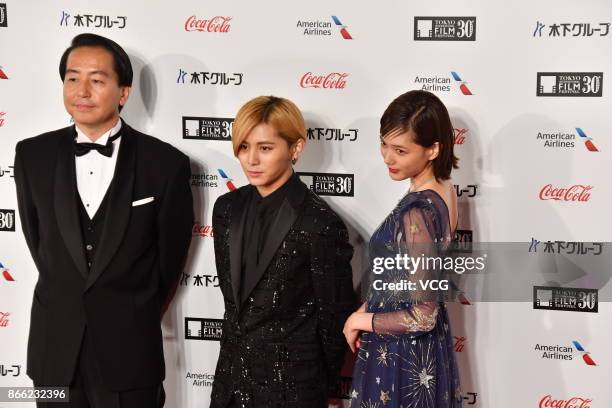 Director Fumihiko Sori, actor Ryosuke Yamada and actress Tsubasa Honda arrive at the red carpet of the 30th Tokyo International Film Festival at...