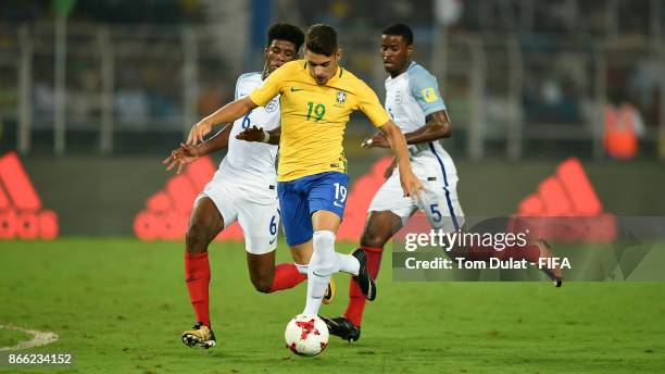 Yuri Alberto of Brazil battles for the ball with Jonathan Panzo and Marc Guehi of England during the FIFA U-17 World Cup India 2017 Semi Final match...