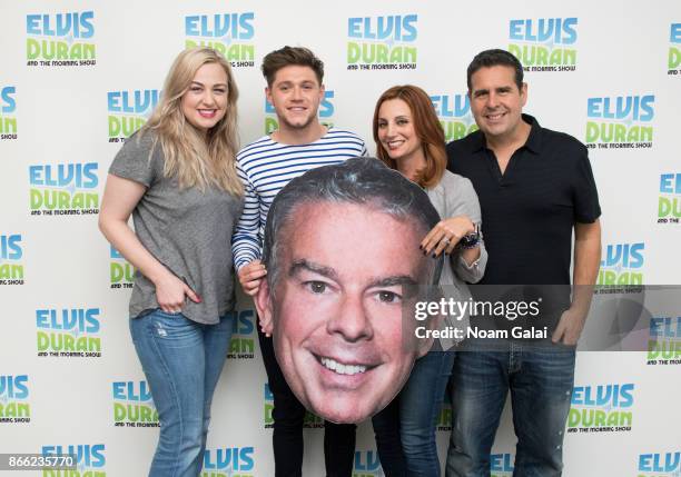 Bethany Watson, Niall Horan, Danielle Monaro and Skeery Jones pose backstage at "The Elvis Duran Z100 Morning Show" at Z100 Studio on October 25,...