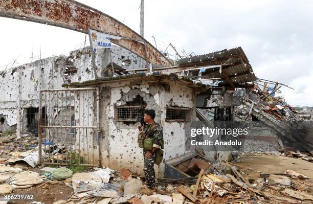 Soldier stands at a destroyed school, which was heavily damaged in the main battle, in Marawi, Lanao del Sur in the Southern Philippines on October...