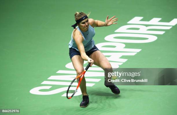 Elina Svitolina of Ukraine plays a forehand in her singles match against Caroline Garcia of France during day 4 of the BNP Paribas WTA Finals...