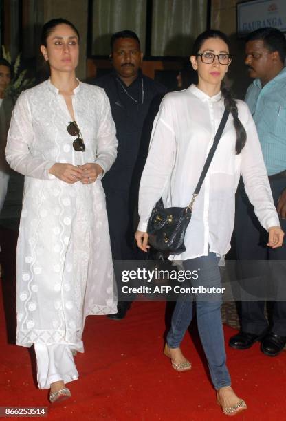 Indian Bollywood actress Kareena Kapoor Khan and Karishma Kapoor attend a prayer meeting for film director Ram Mukherjee in Mumbai on October 25,...