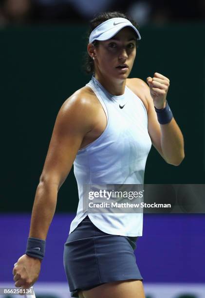 Caroline Garcia of France celebrates a point in her singles match against Elina Svitolina of Ukraine during day 4 of the BNP Paribas WTA Finals...