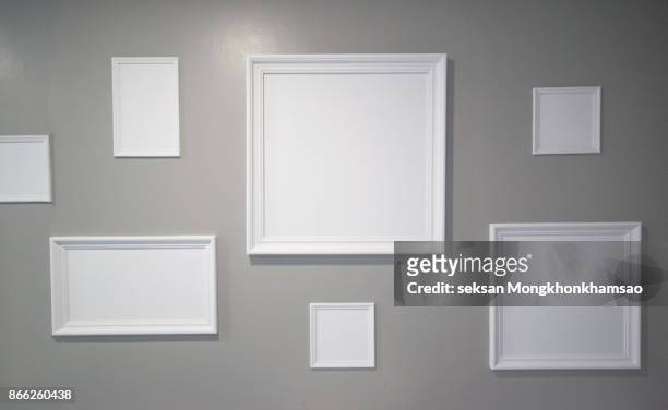 white photo frame on the wall - frame on wall stock pictures, royalty-free photos & images