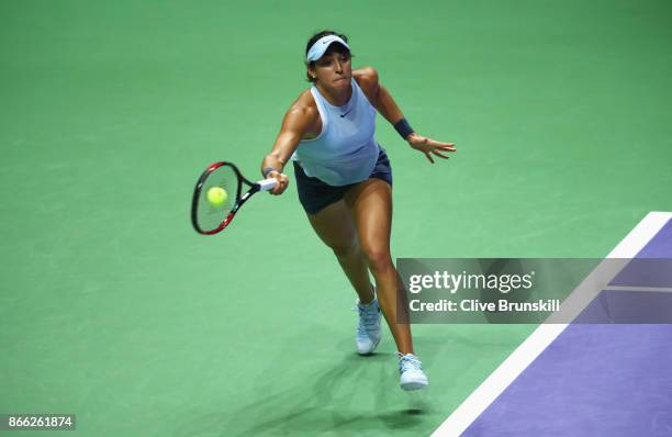 Caroline Garcia of France plays a forehand in her singles match against Elina Svitolina of Ukraine during day 4 of the BNP Paribas WTA Finals...