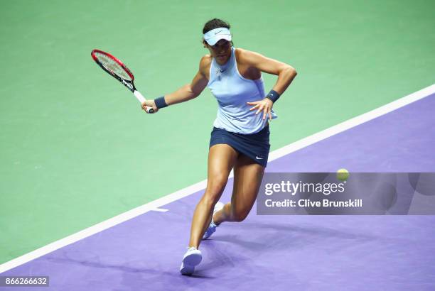 Caroline Garcia of France plays a forehand in her singles match against Elina Svitolina of Ukraine during day 4 of the BNP Paribas WTA Finals...