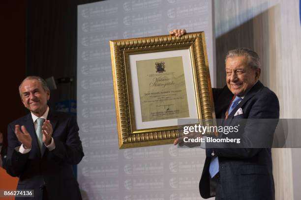 Miguel Aleman Velasco, chairman of the Mexico Business Summit, holds a Person of The Year award received during the Mexico Business Summit in San...