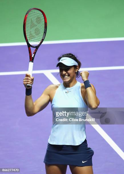 Caroline Garcia of France celebrates victory in her singles match against Elina Svitolina of Ukraine during day 4 of the BNP Paribas WTA Finals...