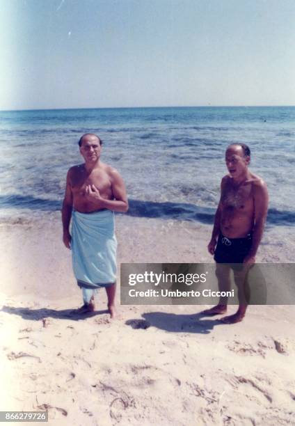 Silvio Berlusconi at the beach with Fedele Confalonieri in Hammamet in Tunisia in August 1984. There was even Bettino Craxi with them, but he is not...