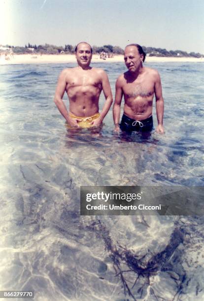 Silvio Berlusconi at the beach with Fedele Confalonieri in Hammamet in Tunisia in August 1984. There was even Bettino Craxi with them, but he is not...