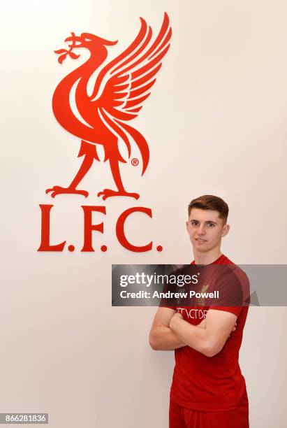 Ben Woodburn poses after signing a contract extension for Liverpool at Melwood Training Ground on October 25, 2017 in Liverpool, England.