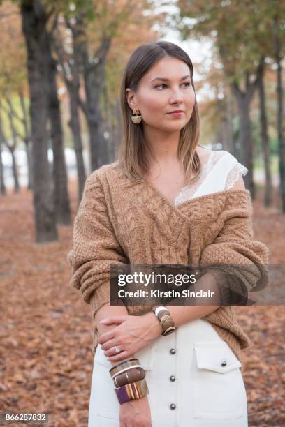 Fashion blogger Angelica Ardasheva wears a Mes Demoiselles sweater, ASOS top, Forever21 skirt day 2 of Paris Womens Fashion Week Spring/Summer 2018,...