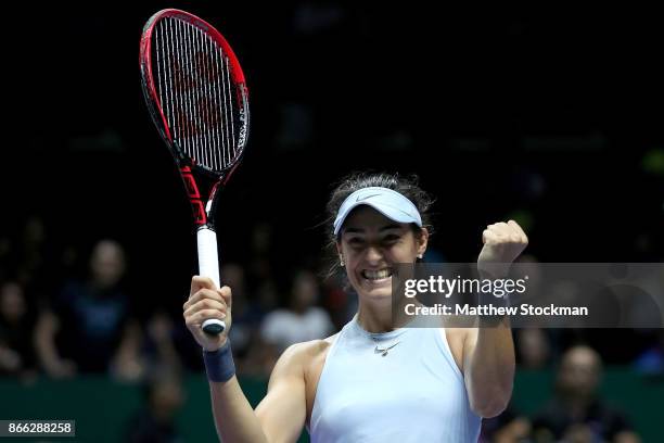 Caroline Garcia of France celebrates victory in her singles match against Elina Svitolina of Ukraine during day 4 of the BNP Paribas WTA Finals...