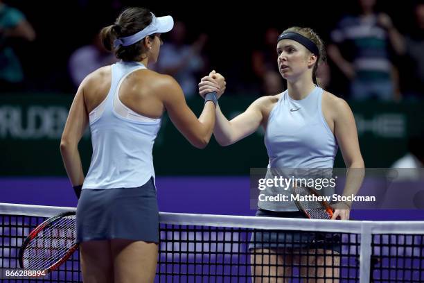 Elina Svitolina of Ukraine shakes hands with Caroline Garcia of France after their singles match during day 4 of the BNP Paribas WTA Finals Singapore...