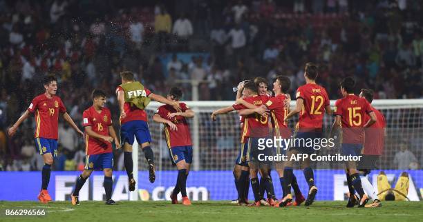 Spain's midfielder Carlos Beitia , Diego Pampin , Hugo Guillamon and teammates celebrate after winning their semifinal football match against Mali...