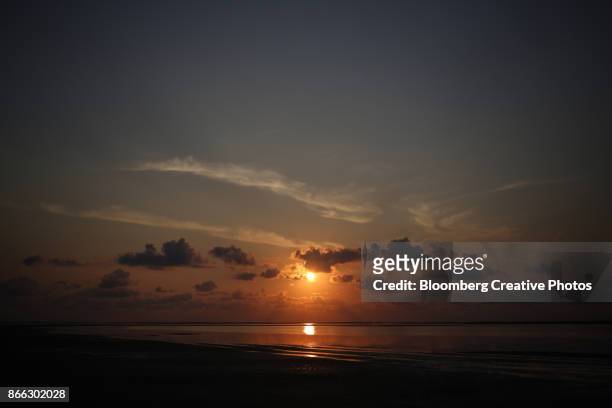 the sun rises near the village of boca chica in texas - southeast stock pictures, royalty-free photos & images