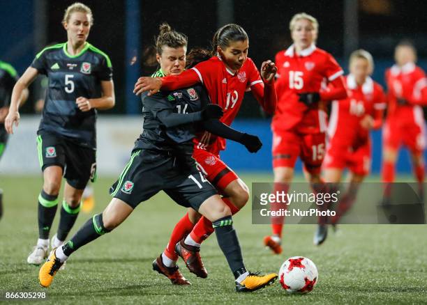 Nadezhda Karpova of Russia women's national team and Hayley Ladd of Wales women's national team vie for the ball during the FIFA Women's World Cup...
