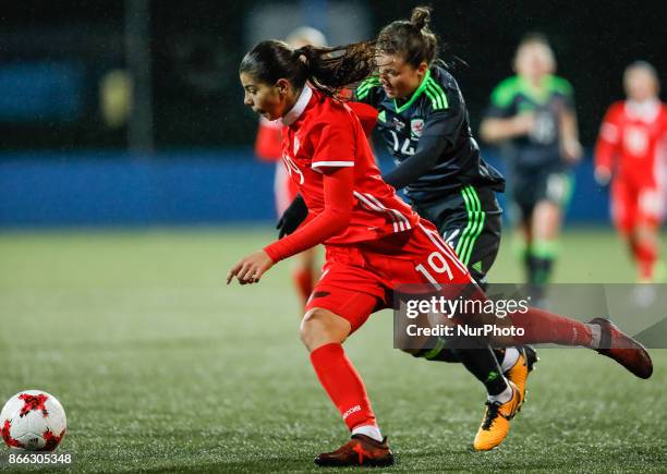 Nadezhda Karpova of Russia women's national team and Hayley Ladd of Wales women's national team vie for the ball during the FIFA Women's World Cup...