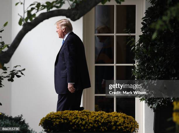 President Donald Trump walks out of the Oval Office before boarding Marine One to depart from the White House on October 25, 2017 in Washington DC....