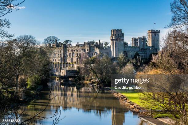 warwick castle photographed on a sunny day in springtime with blue sky and copy space - warwick inglaterra imagens e fotografias de stock