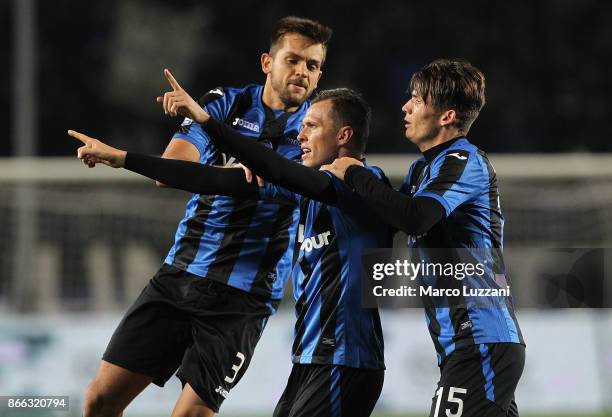 Josip Ilicic of Atalanta BC celebrates his goal with his team-mates Rafael Toloi and Marten De Roon during the Serie A match between Atalanta BC and...