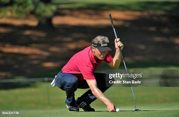 Bernhard Langer studies his putt on the second hole during the first round of the PGA TOUR Champions Dominion Energy Charity Classic at The Country...