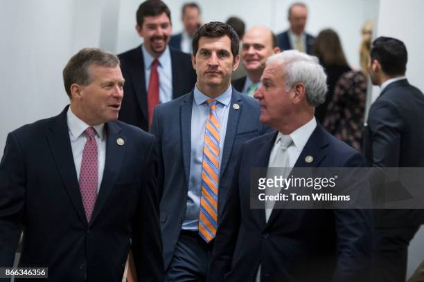 From left, Reps. Charlie Dent, R-Pa., Scott Taylor, R-Va., and Bradley Byrne, R-Ala., leave a meeting of the House Republican Conference in the...
