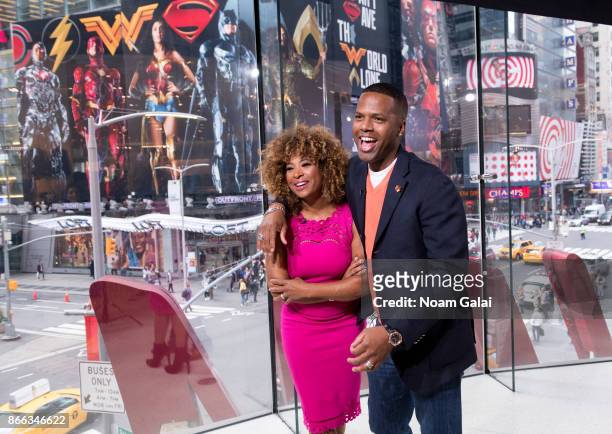 Tanika Ray and A. J. Calloway visit "Extra" at H&M Times Square on October 25, 2017 in New York City.