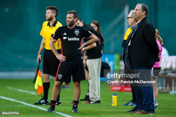United head coach and former player Ben Olsen talks with former DC United and USMNT head coach Bruce Arena during the legends game as part of...