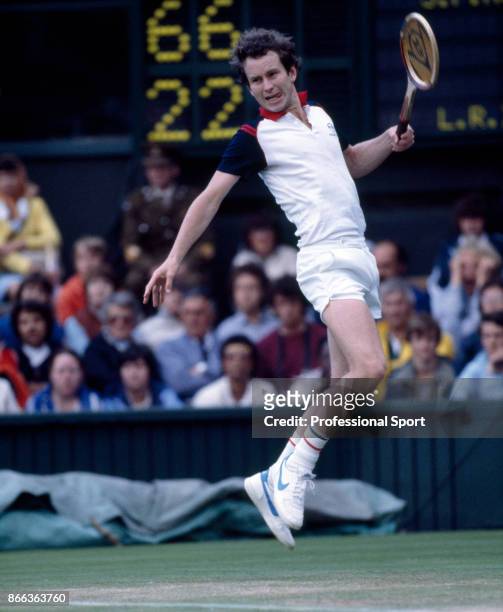American tennis player John McEnroe in action against Lloyd Bourne in the third round during competition to reach the final of the Men's Singles...