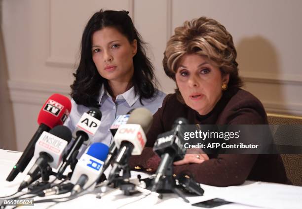 New alleged victim of film producer Harvey Weinstein, actor and model Natassia Malthe listens to her Attorney Gloria Allred speaking during a press...