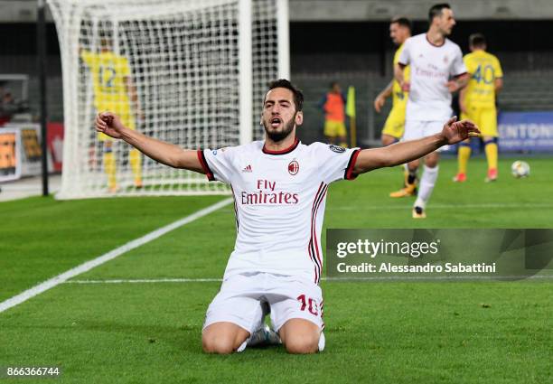 Hakan Calhanoglu of AC Milan celebrates after scoring the 0-3 goal during the Serie A match between AC Chievo Verona and AC Milan at Stadio...