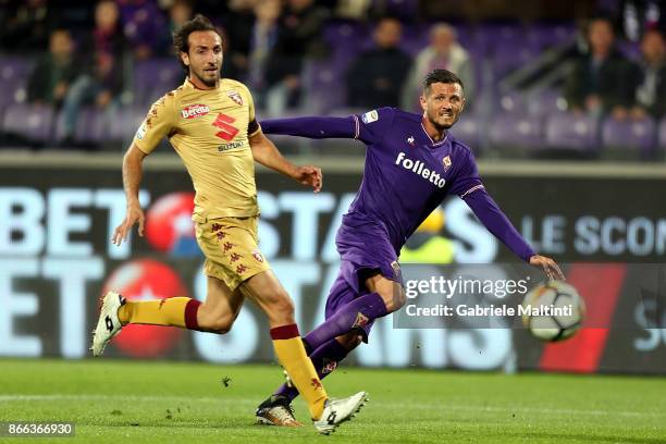 Cyril Thereau of ACF Fiorentina battles for the ball with Emiliano Moretti of Torino Fc during the Serie A match between ACF Fiorentina and Torino FC...