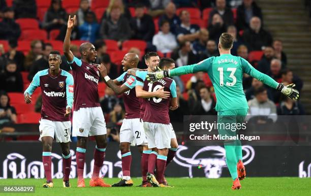 Angelo Ogbonna of West Ham United celebrates with team mates after scoring his side's third goal during the Carabao Cup Fourth Round match between...