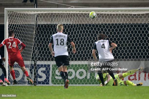Nancy's Slovene forward Patrik Eler scores in spite of Angers' French goalkeeper Alexandre Letellier during the French League Cup football match...
