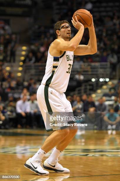 Mirza Teletovic of the Milwaukee Bucks takes a three point shot during a game against the Charlotte Hornets at the BMO Harris Bradley Center on...
