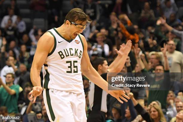 Mirza Teletovic of the Milwaukee Bucks reacts to a three point shot during a game against the Charlotte Hornets at the BMO Harris Bradley Center on...