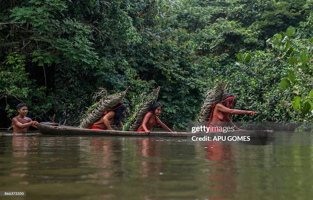 Waiapi Ribe Eriana Waiapi gives directions to cross the Feliz river, while... News ...