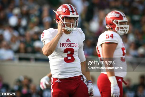 Hoosiers quarterback Peyton Ramsey looks to the sideline for a play call during a Big Ten Conference NCAA football game between Michigan State and...