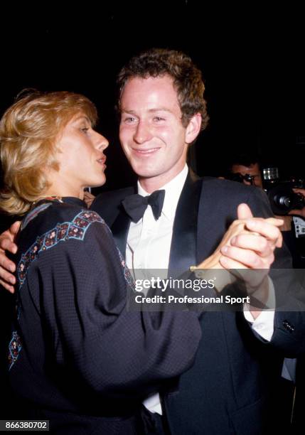 John McEnroe and Martina Navratilova, both of the USA, dance together at the Wimbledon Champions Dinner in London, England on July 8, 1984. McEnroe...