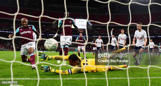 West Ham striker Andre Ayew scores the first West Ham goal past Michel Vorm during the Carabao Cup Fourth Round match between Tottenham Hotspur and...