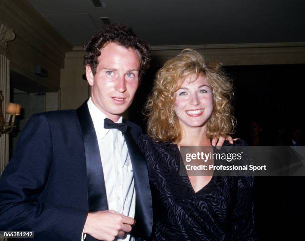 John McEnroe of the USA with his girlfriend Tatum O'Neal at the Players' Evening event during the French Open Tennis Championships at the Stade...