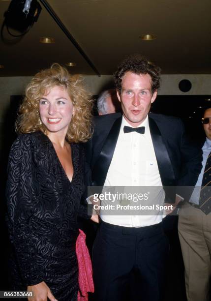 John McEnroe of the USA with his girlfriend Tatum O'Neal at the Players' Evening event during the French Open Tennis Championships at the Stade...