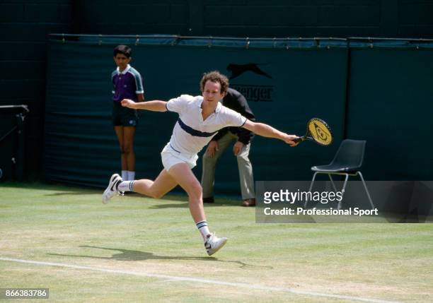 John McEnroe of the USA in action during the Wimbledon Lawn Tennis Championships at the All England Lawn Tennis and Croquet Club circa June, 1985 in...