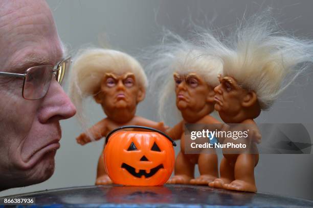 Gallery owner Frank O'Dea with three vinyl dolls which feature President Donald Trump, made by a former sculptor for Disney, Chuck Williams. Donald...