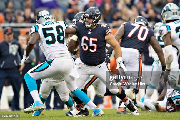 Cody Whitehair of the Chicago Bears chases pass blocks Thomas Davis of the Carolina Panthers at Soldier Field on October 22, 2017 in Chicago,...