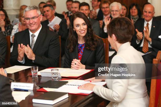 Prime Minister Jacinda Ardern is sworn in by Governor-General Dame Patsy Reddy while deputy Labour leader Kelvin Davis looks on during a swearing-in...